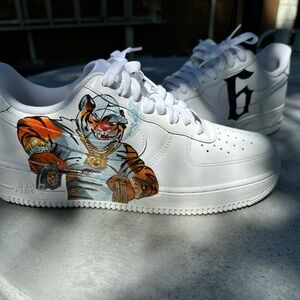 Custom Nike Air Force 1s with a unique design, featuring a tiger and a 6.